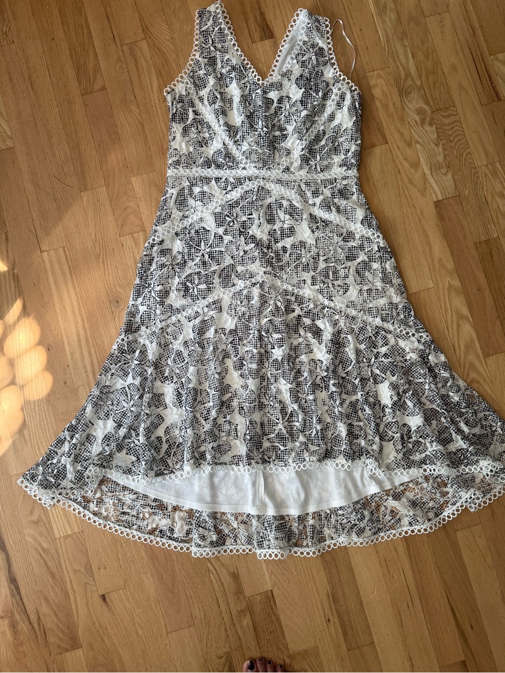 Sleeveless White Midi Dress with Black Lace Pattern